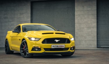 YELLOW FORD MUSTANG PARKED ON THE DRIVEWAY