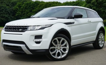 WHITE LAND ROVER RANGE ROVER SUV ON ROAD