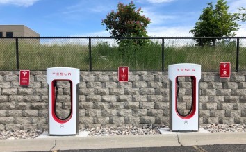 TWO WHITE AND RED TESLA CHARGING STATION