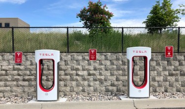 TWO WHITE AND RED TESLA CHARGING STATION
