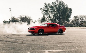 RED COUPE DRIFTING ON ASPHALT ROAD 