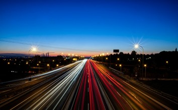 LIGHT TRAILS FROM CARS DRIVING ON THE ROAD