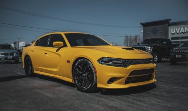 A PARKED YELLOW DODGE CHARGER 