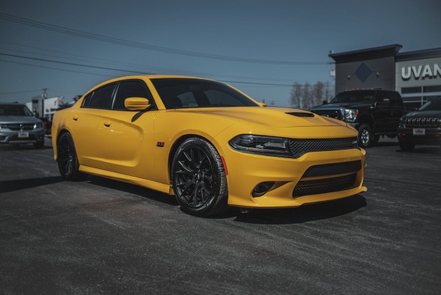 A PARKED YELLOW DODGE CHARGER 